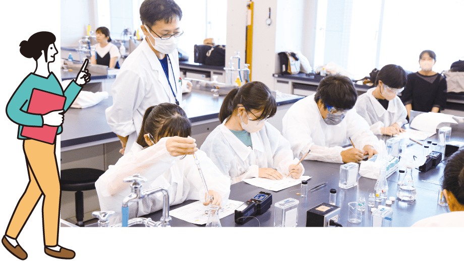 薬の成分を調べる実験中の学生たち